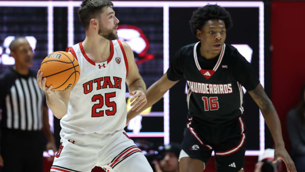Dec 5, 2023; Salt Lake City, Utah, USA; Utah Utes guard Rollie Worster (25) looks to pass the ball against Southern Utah Thunderbirds guard Prophet Johnson (16) during the first half at Jon M. Huntsman Center. Mandatory Credit: Rob Gray-USA TODAY Sports 